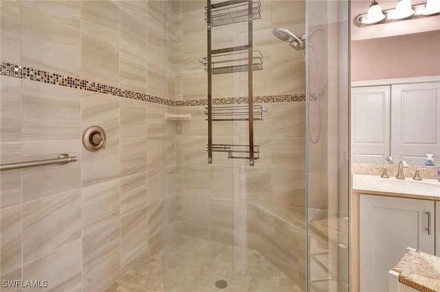 bathroom with a stall shower and vanity
