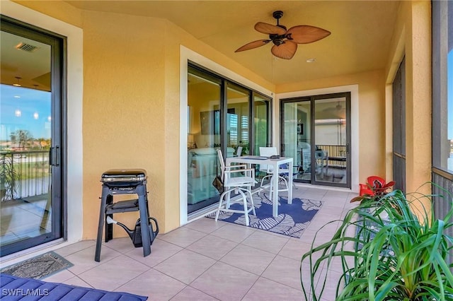 view of patio / terrace featuring visible vents and ceiling fan
