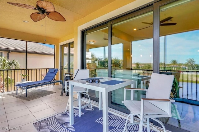 sunroom / solarium with tile patterned flooring
