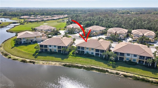 birds eye view of property featuring a residential view and a water view