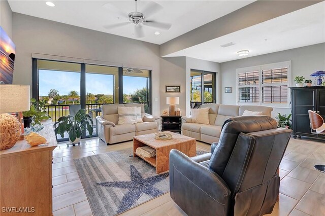 living room featuring recessed lighting, visible vents, and ceiling fan