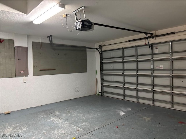 garage with electric panel and a garage door opener