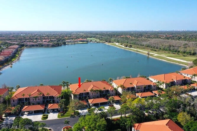 bird's eye view featuring a residential view and a water view