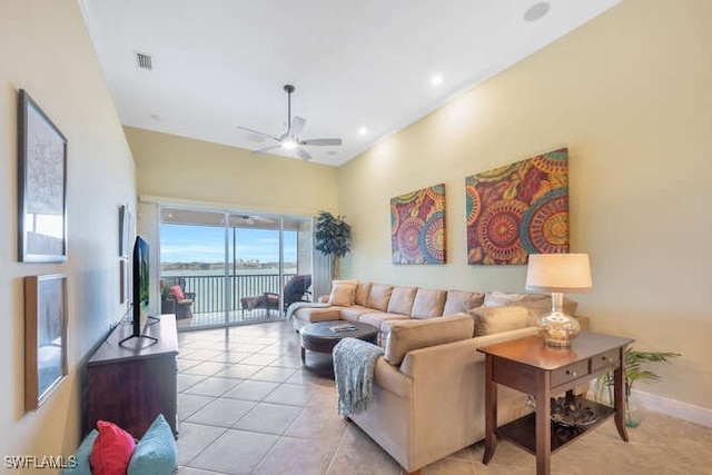 living room featuring light tile patterned floors, visible vents, baseboards, ceiling fan, and recessed lighting