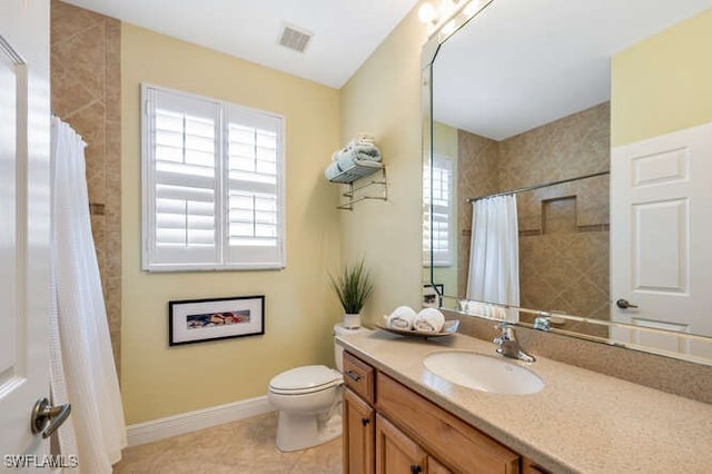 full bathroom with tile patterned flooring, toilet, vanity, visible vents, and baseboards