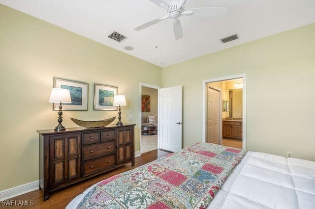 bedroom with a ceiling fan, visible vents, ensuite bath, and baseboards