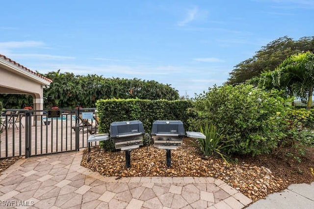 view of patio / terrace with fence and area for grilling