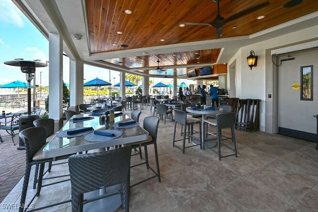 dining room with wooden ceiling and ceiling fan