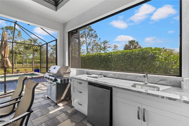 sunroom / solarium featuring a sink