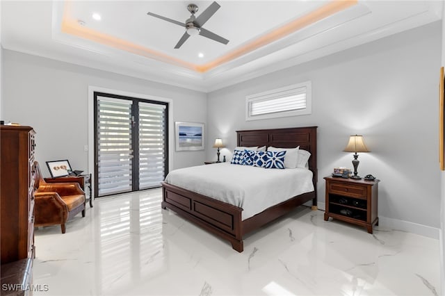 bedroom with access to exterior, a tray ceiling, marble finish floor, and baseboards