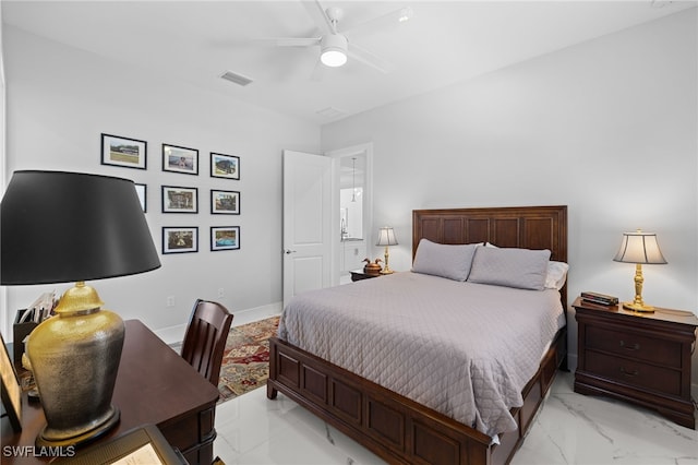 bedroom featuring a ceiling fan, marble finish floor, visible vents, and baseboards