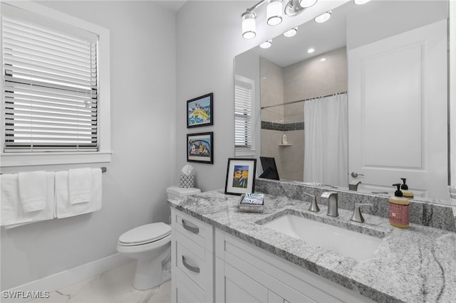 bathroom featuring toilet, a shower with shower curtain, vanity, baseboards, and marble finish floor