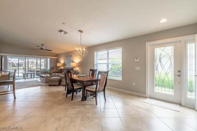 dining room with a wealth of natural light, visible vents, baseboards, and light tile patterned floors