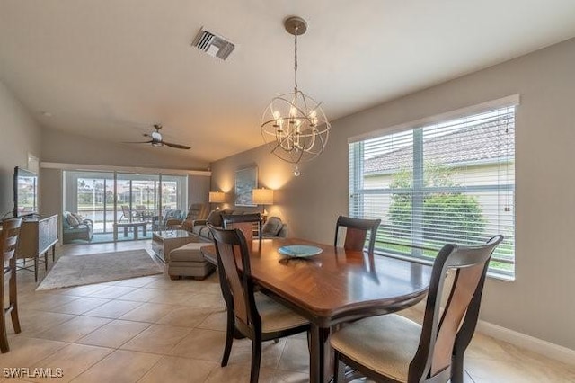 dining room featuring light tile patterned floors, ceiling fan with notable chandelier, visible vents, and baseboards