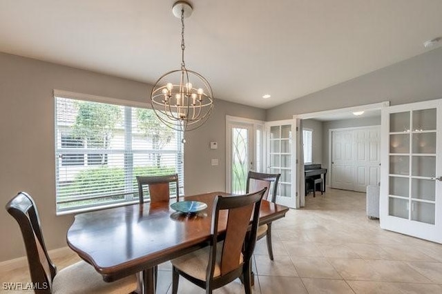 dining space with light tile patterned floors, baseboards, vaulted ceiling, french doors, and a chandelier