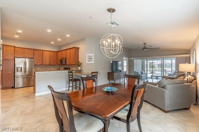 dining area featuring ceiling fan with notable chandelier, visible vents, and recessed lighting