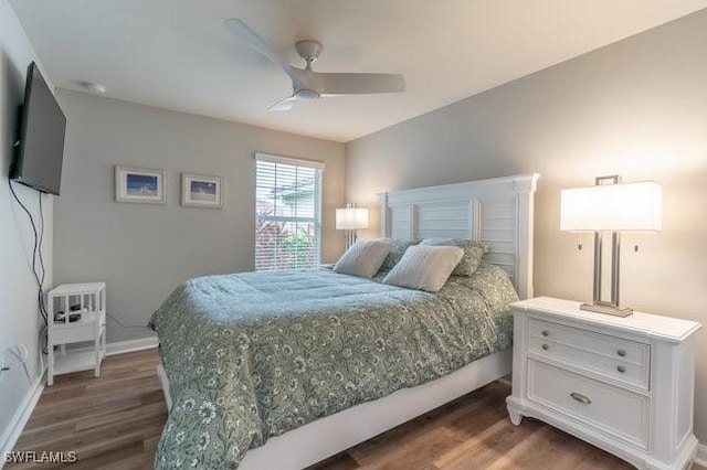 bedroom featuring ceiling fan, wood finished floors, and baseboards