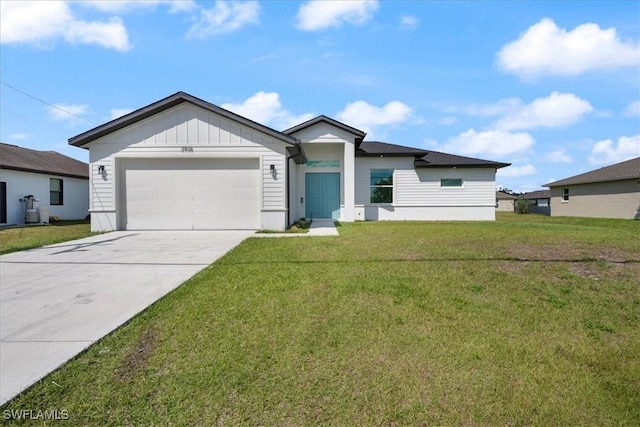 view of front of property with an attached garage, driveway, board and batten siding, and a front yard