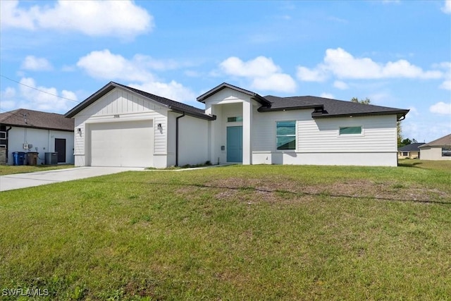 view of front of home with an attached garage, driveway, a front lawn, and central air condition unit