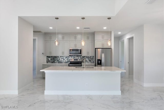 kitchen featuring backsplash, marble finish floor, stainless steel appliances, light countertops, and a sink