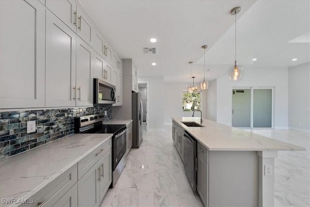 kitchen with recessed lighting, a sink, visible vents, marble finish floor, and appliances with stainless steel finishes