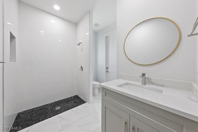 full bath featuring visible vents, toilet, marble finish floor, walk in shower, and vanity