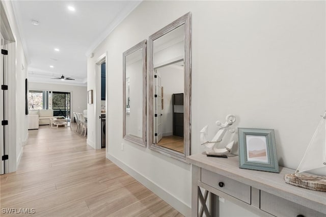 hall with recessed lighting, baseboards, light wood-style floors, and crown molding