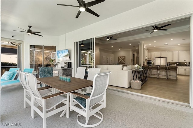 exterior space with recessed lighting, light speckled floor, and crown molding