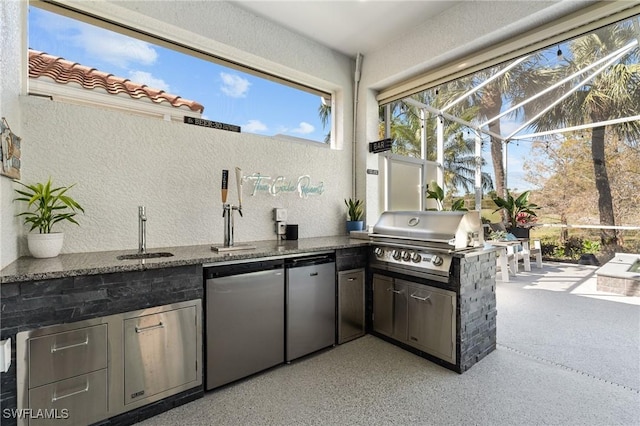 view of patio / terrace with a sink, area for grilling, a grill, and a lanai