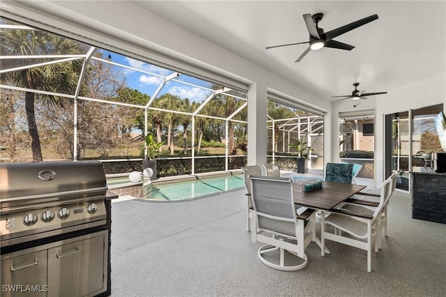 view of patio with exterior kitchen, glass enclosure, a grill, an outdoor pool, and a ceiling fan