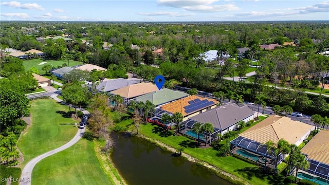 aerial view featuring a residential view, a view of trees, and a water view