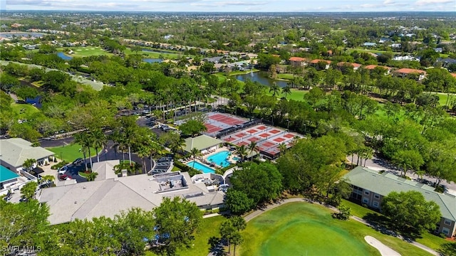 aerial view featuring a residential view, a water view, and view of golf course