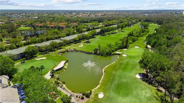 bird's eye view featuring view of golf course and a water view