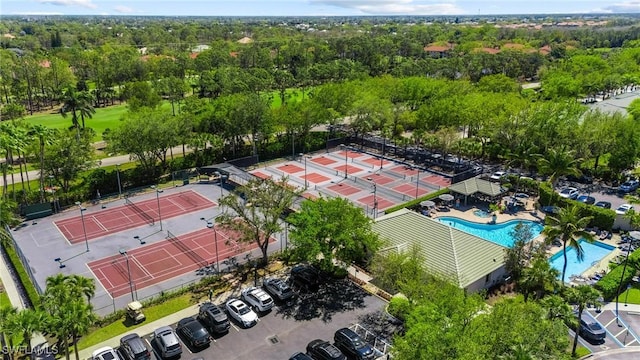 birds eye view of property with a wooded view