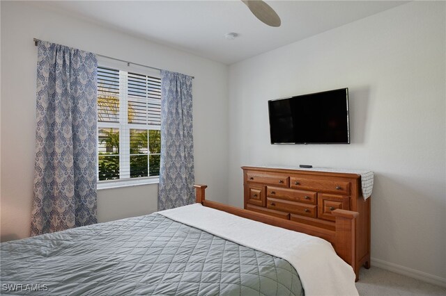 bedroom with carpet floors, baseboards, and a ceiling fan