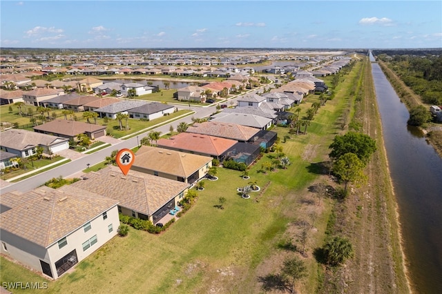 bird's eye view with a water view and a residential view