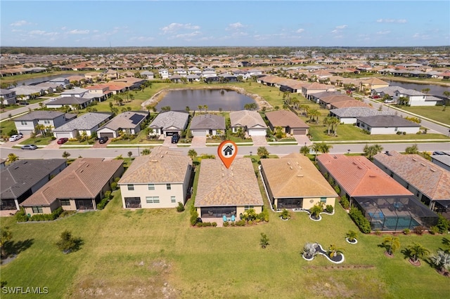 aerial view with a water view and a residential view