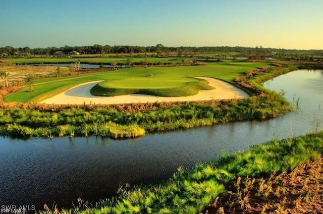 view of community featuring a water view and view of golf course