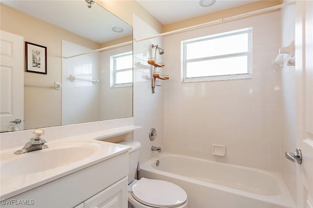 bathroom with toilet, washtub / shower combination, and vanity