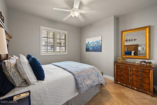 bedroom with baseboards, a ceiling fan, and tile patterned floors