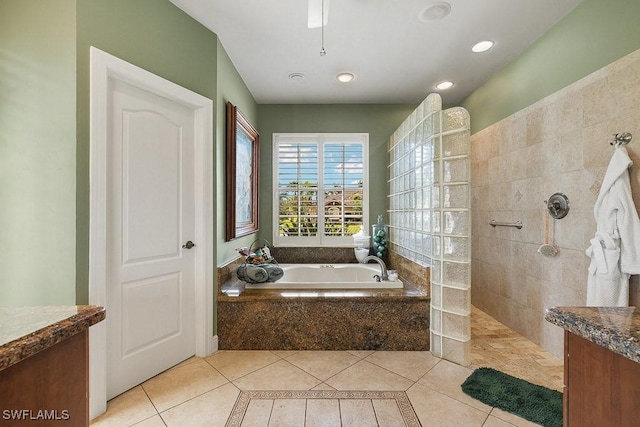 full bathroom featuring recessed lighting, walk in shower, a bath, and tile patterned floors