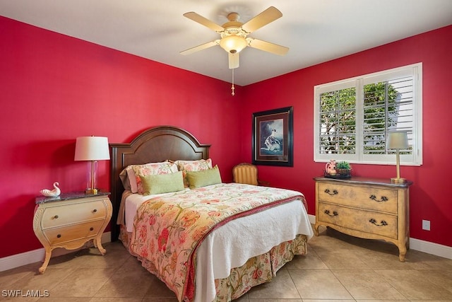 tiled bedroom with baseboards and a ceiling fan