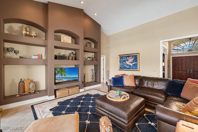 tiled living room featuring built in shelves and high vaulted ceiling