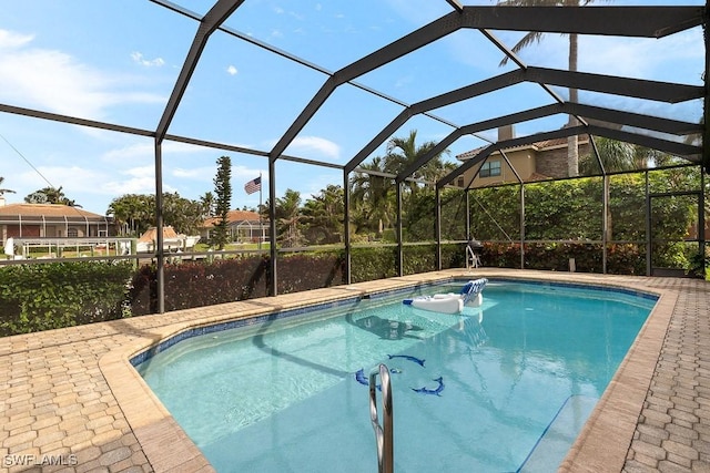 outdoor pool featuring a lanai and a patio