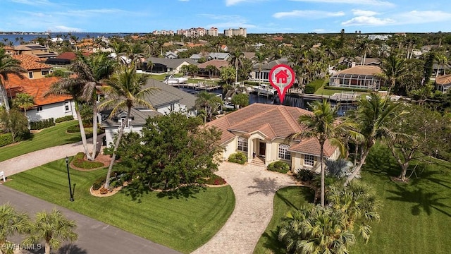 birds eye view of property with a residential view