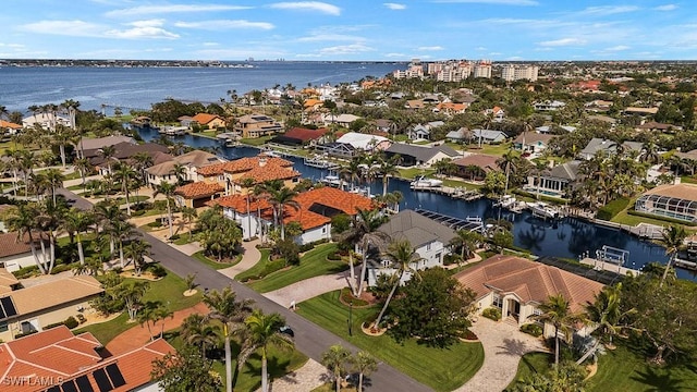 bird's eye view with a water view and a residential view