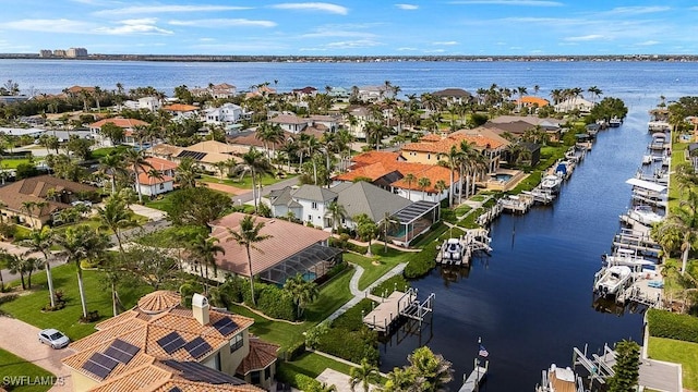 aerial view with a water view and a residential view