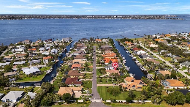 birds eye view of property with a residential view and a water view