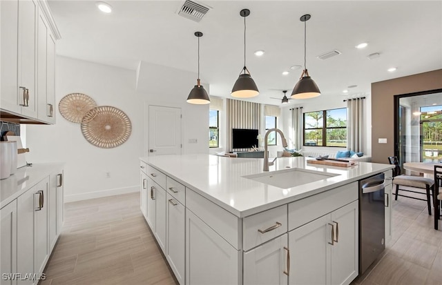 kitchen with light countertops, visible vents, a sink, and recessed lighting