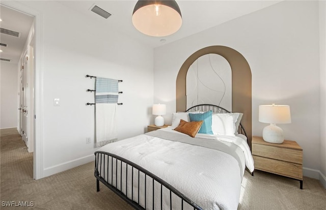 bedroom with carpet flooring, visible vents, and baseboards